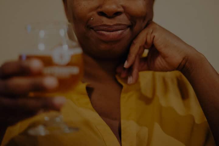 A group clinking cans and glasses